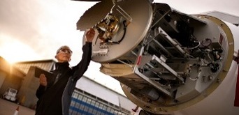 engineer fixing a plane engine